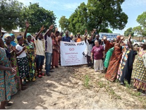 Community members gather at the new borehole