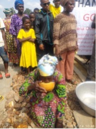 Women collecting water before the borehole
